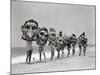 Women Holding Giant Masks-Bettmann-Mounted Premium Photographic Print