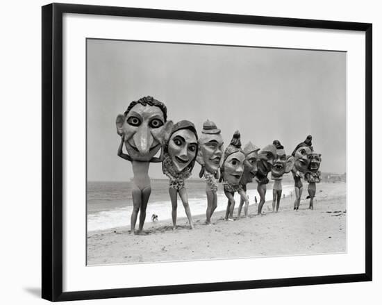 Women Holding Giant Masks-Bettmann-Framed Photographic Print