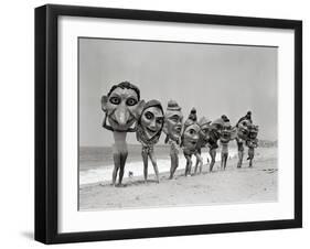 Women Holding Giant Masks-Bettmann-Framed Photographic Print