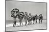 Women Holding Giant Masks-Bettmann-Mounted Photographic Print