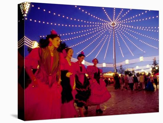 Women in Flamenco Dresses at Feira de Abril, Sevilla, Spain-Merrill Images-Stretched Canvas