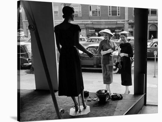 Women looking at window display-null-Stretched Canvas