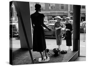 Women looking at window display-null-Stretched Canvas