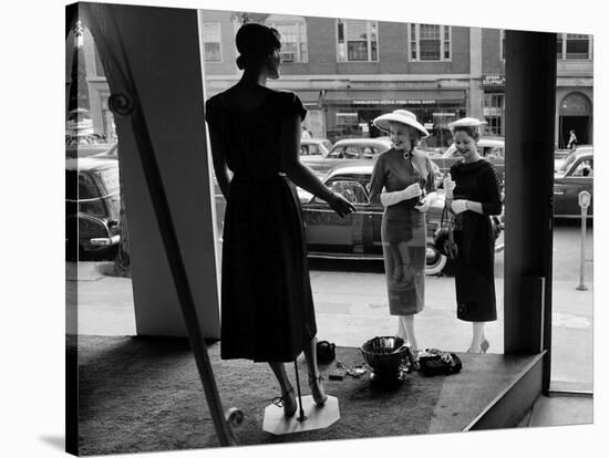 Women looking at window display-null-Stretched Canvas