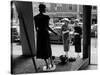 Women looking at window display-null-Stretched Canvas