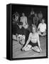 Women Meditating During their Exercises-Loomis Dean-Framed Stretched Canvas