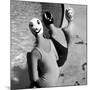 Women Modeling Bathing Caps with Faces on Them-Ralph Crane-Mounted Photographic Print