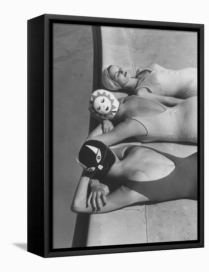 Women Modeling Bathing Caps with Faces on Them-Ralph Crane-Framed Stretched Canvas