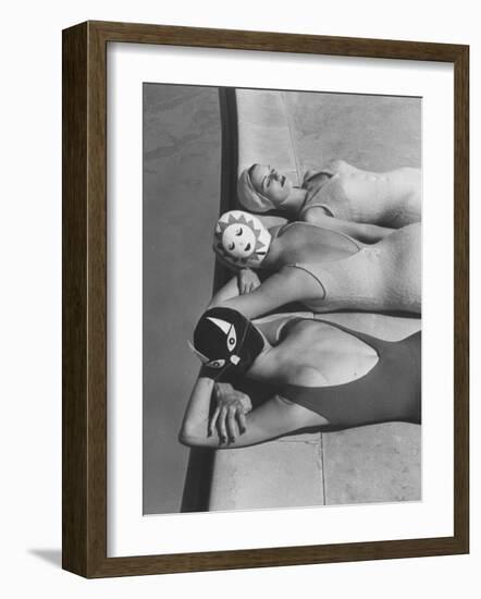 Women Modeling Bathing Caps with Faces on Them-Ralph Crane-Framed Photographic Print