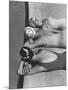 Women Modeling Bathing Caps with Faces on Them-Ralph Crane-Mounted Photographic Print