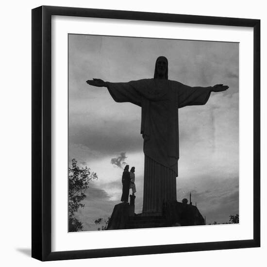 Women Posing with the Statue Called "Christ the Redeemer"-Hart Preston-Framed Premium Photographic Print