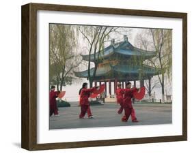 Women Practising Tai Chi in Front of a Pavilion on West Lake, Hangzhou, Zhejiang Province, China-Kober Christian-Framed Photographic Print