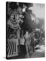 Women Rail Workers Standing at Work on Engine of Train, During WWI at Great Northern Railway-null-Stretched Canvas