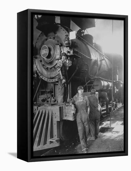 Women Rail Workers Standing at Work on Engine of Train, During WWI at Great Northern Railway-null-Framed Stretched Canvas