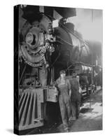 Women Rail Workers Standing at Work on Engine of Train, During WWI at Great Northern Railway-null-Stretched Canvas