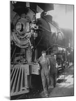 Women Rail Workers Standing at Work on Engine of Train, During WWI at Great Northern Railway-null-Mounted Photographic Print