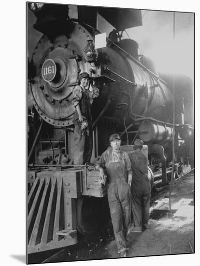 Women Rail Workers Standing at Work on Engine of Train, During WWI at Great Northern Railway-null-Mounted Photographic Print