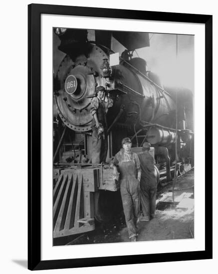 Women Rail Workers Standing at Work on Engine of Train, During WWI at Great Northern Railway-null-Framed Premium Photographic Print