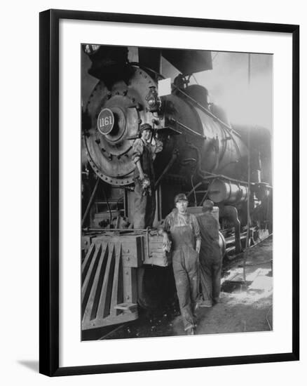 Women Rail Workers Standing at Work on Engine of Train, During WWI at Great Northern Railway-null-Framed Photographic Print