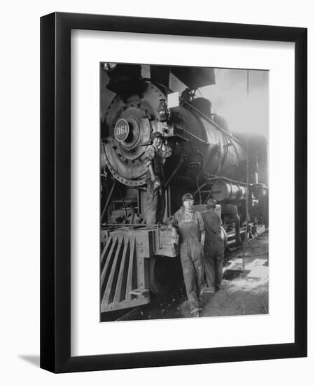 Women Rail Workers Standing at Work on Engine of Train, During WWI at Great Northern Railway-null-Framed Premium Photographic Print