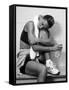 Women Resting after Exercise Session in Fitness Studio, New York, New York, USA-Paul Sutton-Framed Stretched Canvas