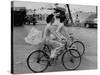 Women Riding Bicycles in Saigon-John Dominis-Stretched Canvas