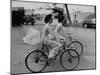 Women Riding Bicycles in Saigon-John Dominis-Mounted Premium Photographic Print