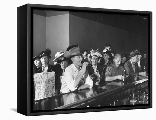 Women's Christian Temperance Union Members Invading Bar While Customers Remain Indifferent-Peter Stackpole-Framed Stretched Canvas