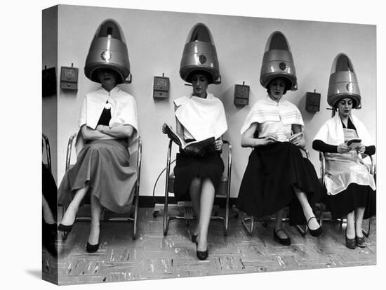 Women Sitting and Reading under Hairdryers at Rockefeller Center "Pamper Club"-Nina Leen-Stretched Canvas
