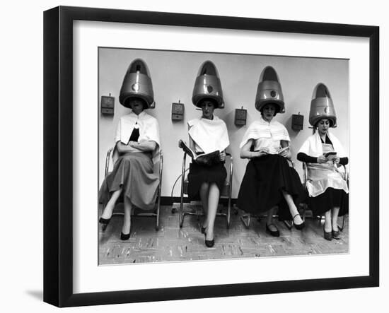 Women Sitting and Reading under Hairdryers at Rockefeller Center "Pamper Club"-Nina Leen-Framed Photographic Print