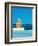 Women Sitting by Swimming Pool near Ocean-null-Framed Giclee Print