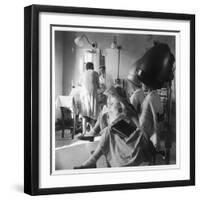 Women Sitting under Hair Dryers at the Hairdressers-Henry Grant-Framed Photographic Print