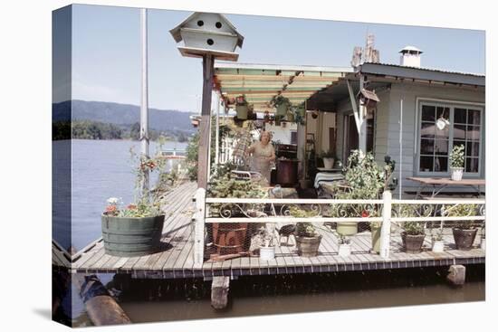 Women Standing Amidst Potted Plants on Floating Home Deck in Portage Bay, Seattle, Wa, 1971-Michael Rougier-Stretched Canvas