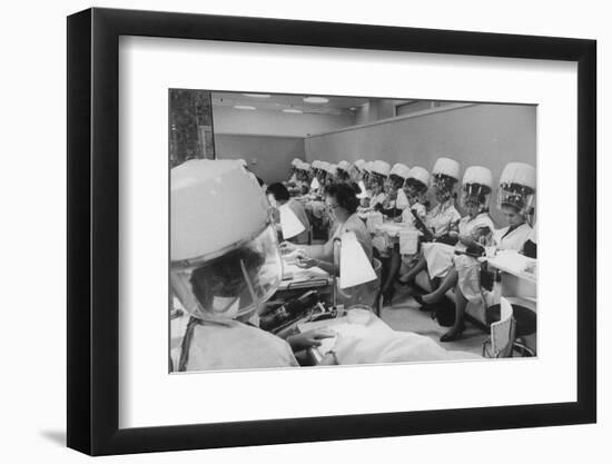 Women under Hair Dryers Getting Hair Styled in Beauty Salon at Saks Fifth Ave. Department Store-Alfred Eisenstaedt-Framed Premium Photographic Print