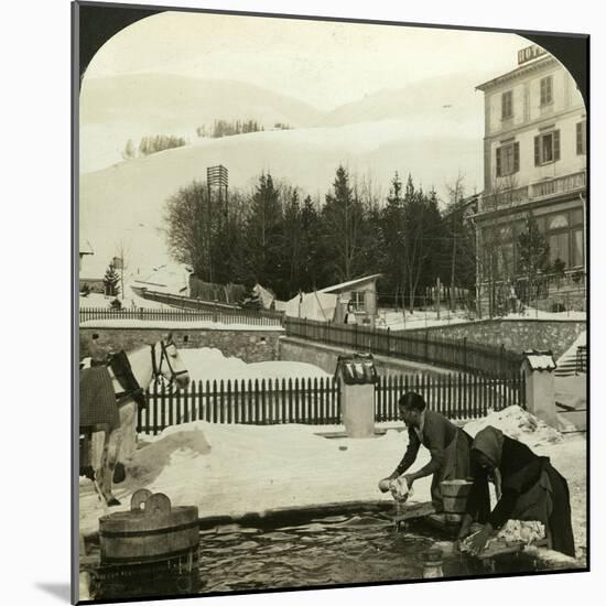 Women Washing Clothes at the Public Fountain in Midwinter, Zuoz, Switzerland-HC White-Mounted Photographic Print