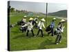 Women Wearing the Traditional Vietnamese Conical Hats Haul Golf Clubs-null-Stretched Canvas