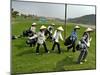 Women Wearing the Traditional Vietnamese Conical Hats Haul Golf Clubs-null-Mounted Premium Photographic Print