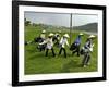 Women Wearing the Traditional Vietnamese Conical Hats Haul Golf Clubs-null-Framed Photographic Print