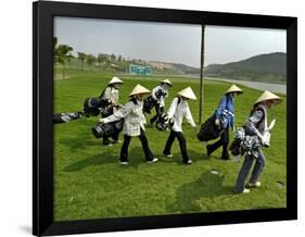 Women Wearing the Traditional Vietnamese Conical Hats Haul Golf Clubs-null-Framed Photographic Print