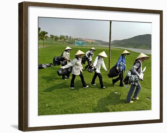 Women Wearing the Traditional Vietnamese Conical Hats Haul Golf Clubs-null-Framed Photographic Print