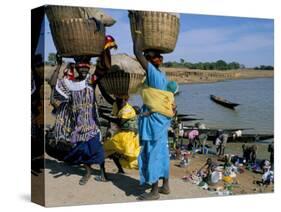 Women with Baskets of Laundry on Their Heads Beside the River, Djenne, Mali, Africa-Bruno Morandi-Stretched Canvas