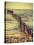 Wood Pilings on Beach, Vintage Retro Effect.-Maciej Bledowski-Stretched Canvas