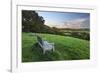 Wooden bench looking over green field countryside of High Weald on summer evening, Burwash-Stuart Black-Framed Photographic Print