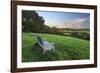 Wooden bench looking over green field countryside of High Weald on summer evening, Burwash-Stuart Black-Framed Photographic Print