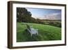 Wooden bench looking over green field countryside of High Weald on summer evening, Burwash-Stuart Black-Framed Photographic Print