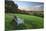 Wooden bench looking over green field countryside of High Weald on summer evening, Burwash-Stuart Black-Mounted Premium Photographic Print