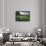 Wooden bench looking over green field countryside of High Weald on summer evening, Burwash-Stuart Black-Framed Photographic Print displayed on a wall