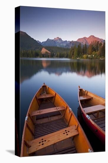 Wooden Boats on Strbske Pleso Lake in the Tatra Mountains of Slovakia, Europe. Autumn-Adam Burton-Stretched Canvas