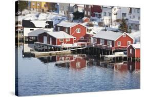 Wooden Cabins at the Waters Edge in the Town of Raine in the Lofoten Islands, Arctic, Norway-David Clapp-Stretched Canvas