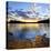 Wooden Chair on Beach of Relaxing Lake at Sunset in Algonquin Park, Canada-elenathewise-Stretched Canvas